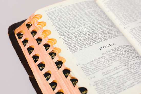 A Bible opened to the book of Hosea.