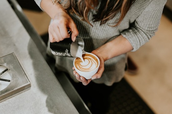 Going to a coffee shop is one way to reward yourself. It can feel special when watching a barista prepare a latte.