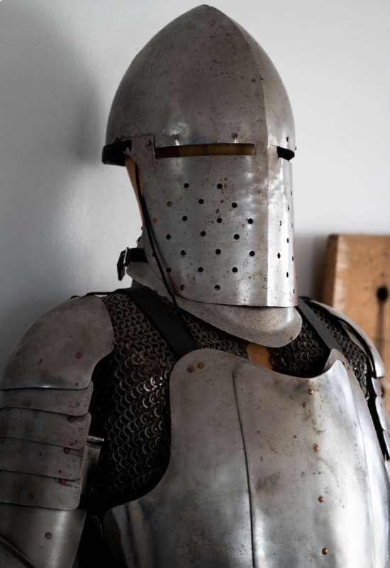 A standing suit of medieval armor.