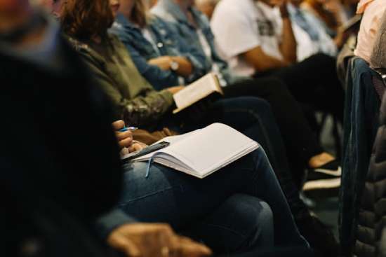 Study participating in Bible study, a part of the daily school routine at Adventist schools