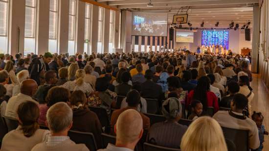 An Adventist church brimming with people attending a service