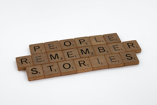 Scrabble letters that say, People remember stories