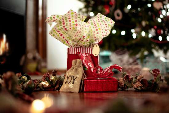 Wrapped presents underneath a Christmas tree