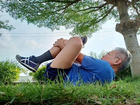 A man stretching his muscles to care for his physical health