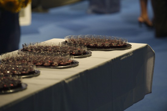 Trays with communion cups are sometimes laid out on a table before being served. They remind us of how Jesus shed His blood for us.