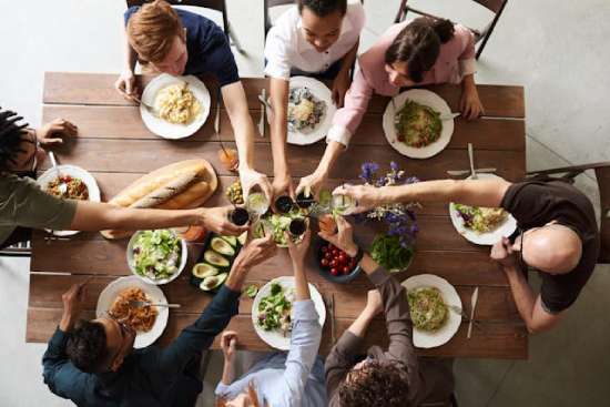 A family sitting around a table eating Easter dinner