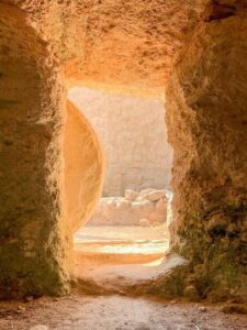 A tomb with a large stone in front of it, like the one Jesus resurrected from