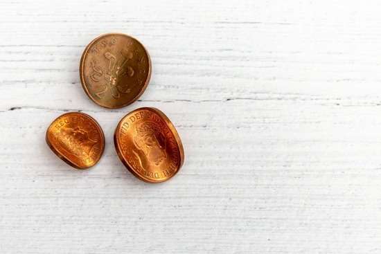 Copper coins, representing what first-century Jews might have used to pay taxes to Matthew