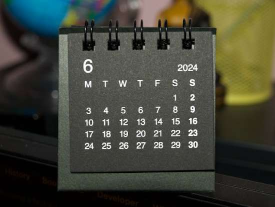 A spiral-bound calendar showing both Saturday and Sunday