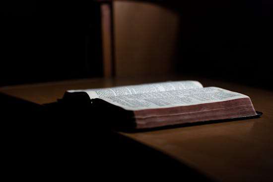 An open Bible sitting on a table