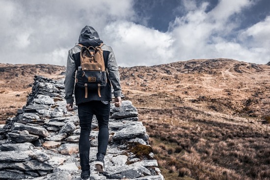 A man hiking and wandering in the desert