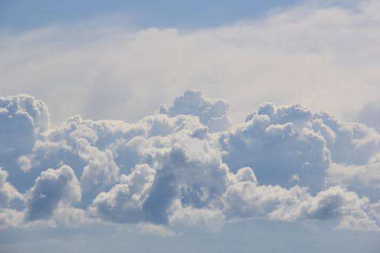 Puffy white clouds, representing heaven 