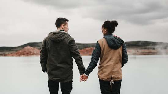 A man and woman holding hands.