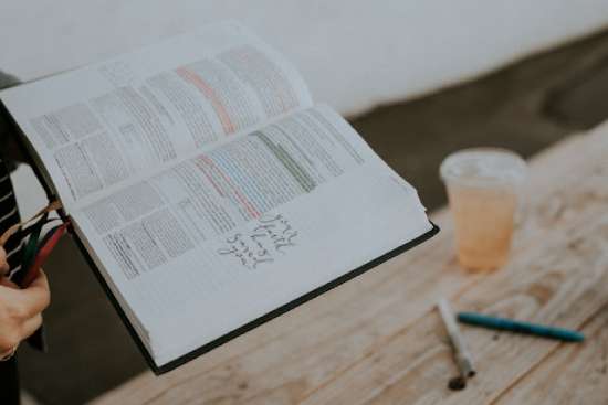 A Bible open as someone studies it