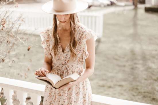 A woman reading her Bible outside