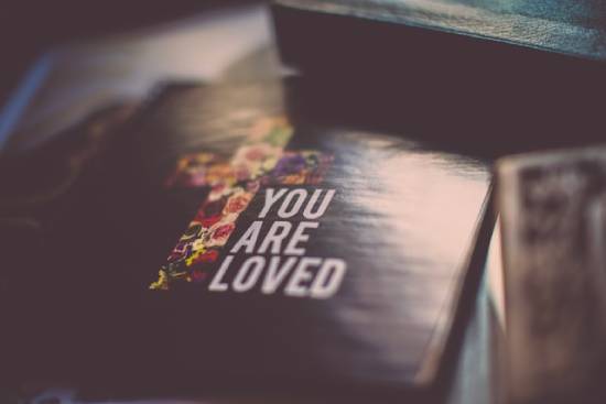 A book cover with a cross and the phrase, "You Are Loved." God's love is the focal point of salvation.